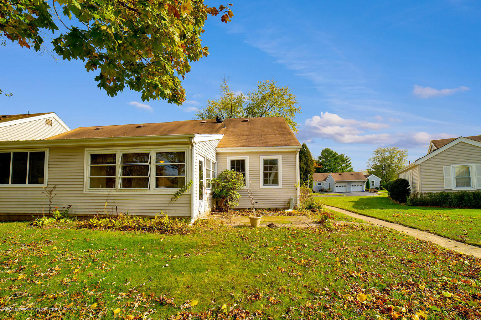 136 Rigi Strasse, Unit 1000 Freehold, NJ 07728 - Photo 20 of 25 a front view of a house with garden