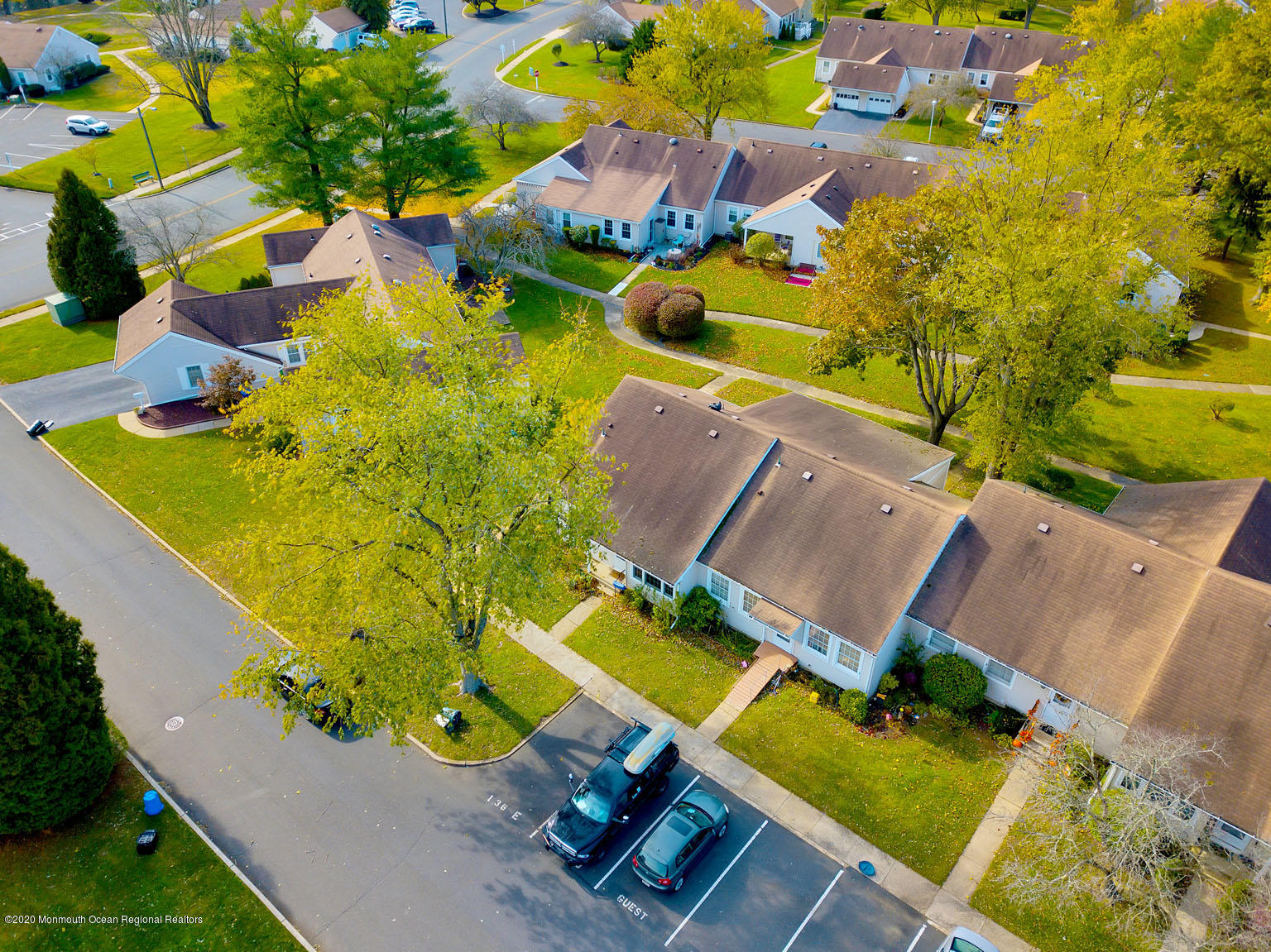 136 Rigi Strasse, Unit 1000 Freehold, NJ 07728 - Photo 22 of 25 an aerial view of a house with a swimming pool