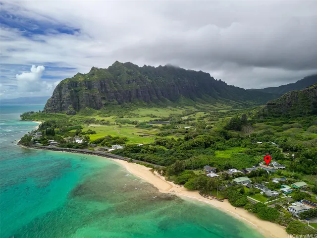 a view of a pathway both side of grassy field with shrub