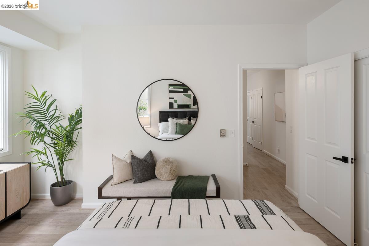 2029 Channing Way, Unit 3D Berkeley, CA 94704 - Photo 34 of 54 Bright interior space featuring light wood-finish flooring, white walls, and a large window