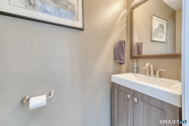 a bedroom with a bed and a television