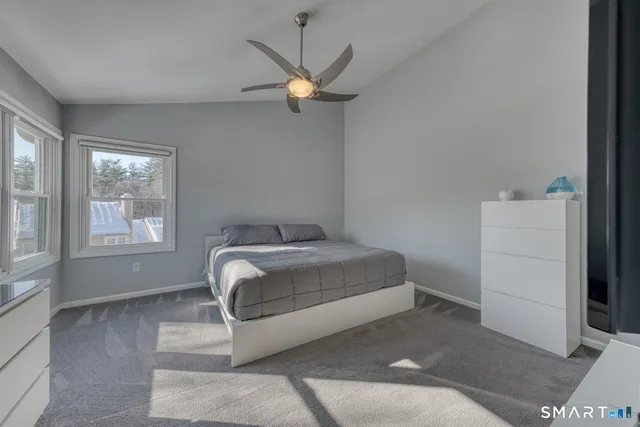 a kitchen with stainless steel appliances a stove a sink cabinets and wooden floor