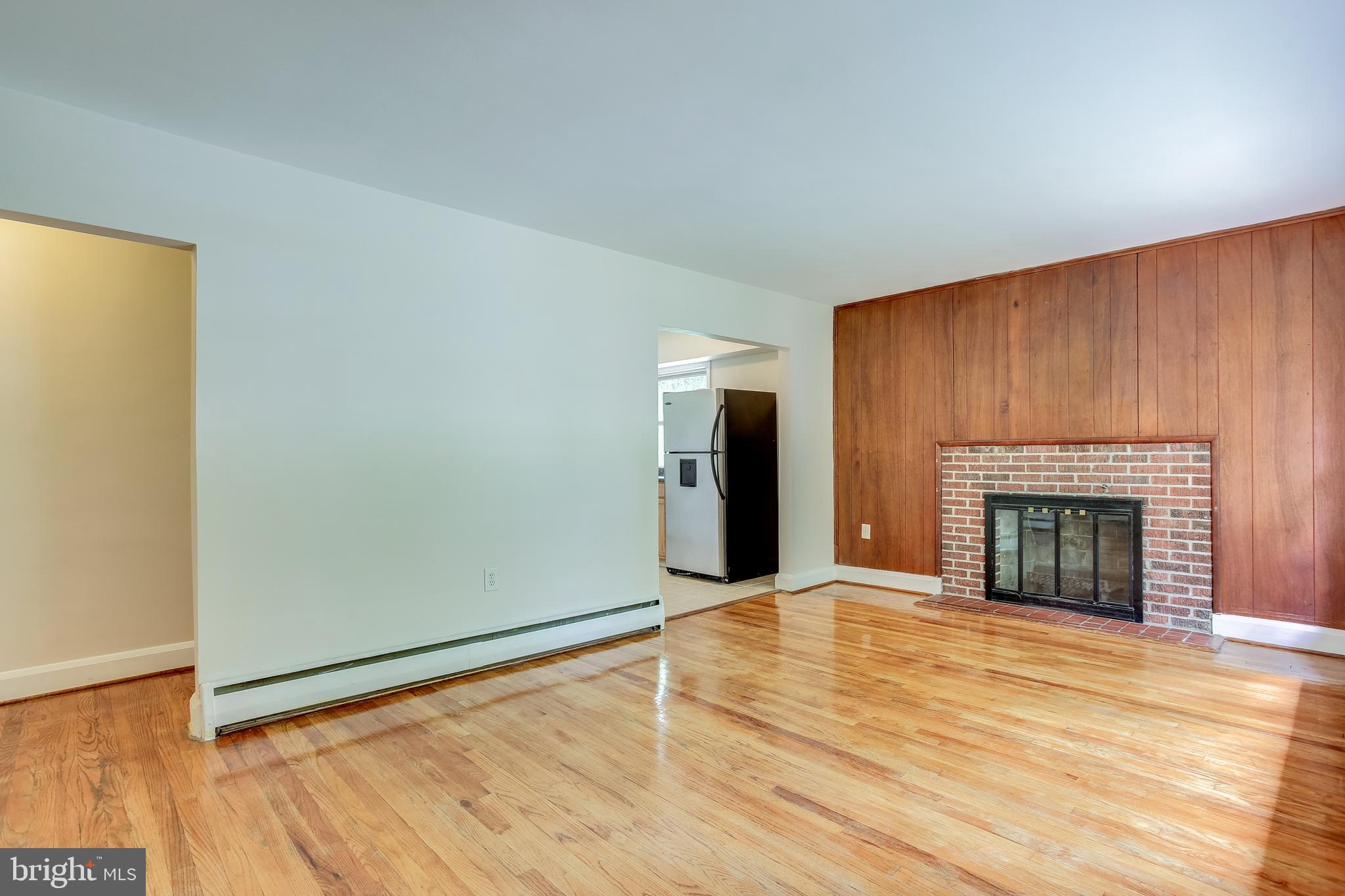 3722 Chesholm Road Baltimore, MD 21216 - Photo 5 of 23 View of living room with fireplace