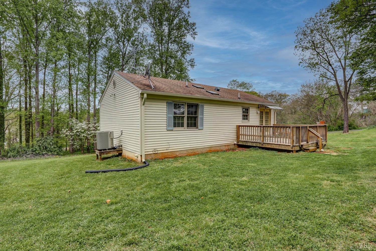 127 Southern Lane Monroe, VA 24574 - Photo 33 of 44 a backyard of a house with barbeque oven and trees