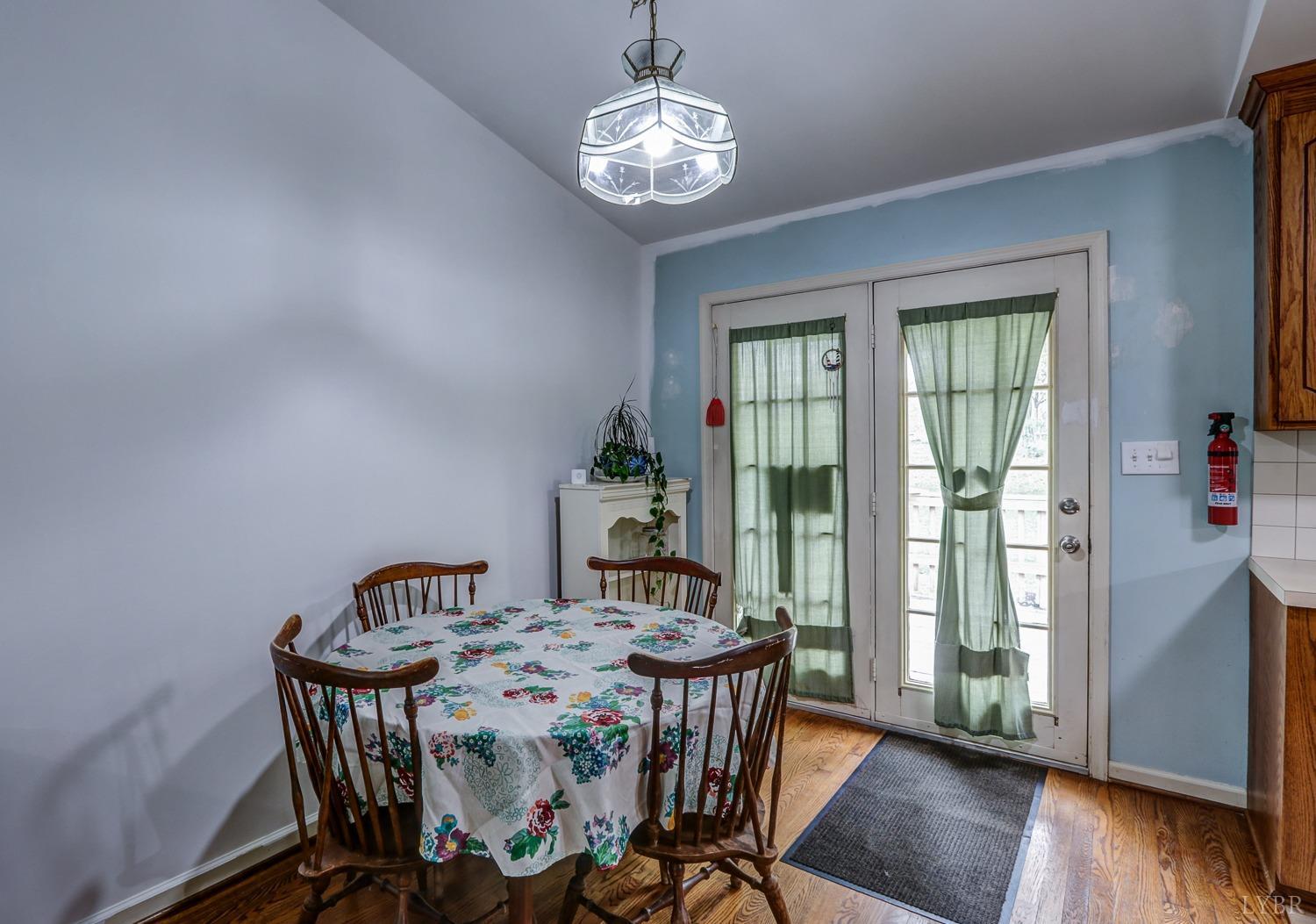 127 Southern Lane Monroe, VA 24574 - Photo 7 of 44 a view of a dining room with furniture window and wooden floor