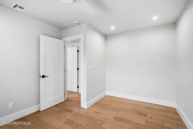 a bedroom with a bed and a sink