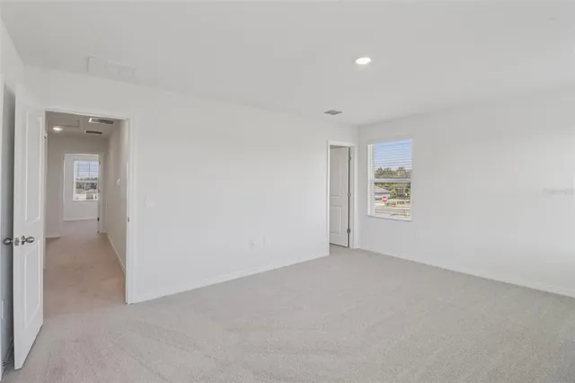 an empty room with a bathroom