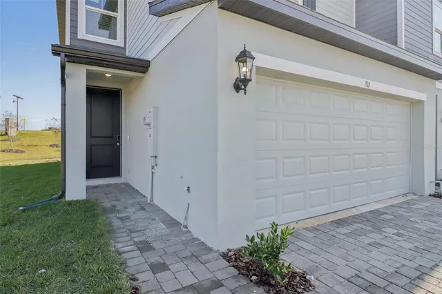 a view of a pathway besides a house