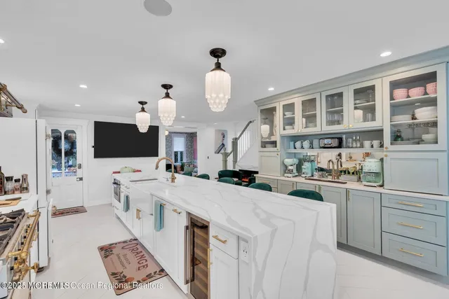 a kitchen with stainless steel appliances granite countertop a sink and cabinets