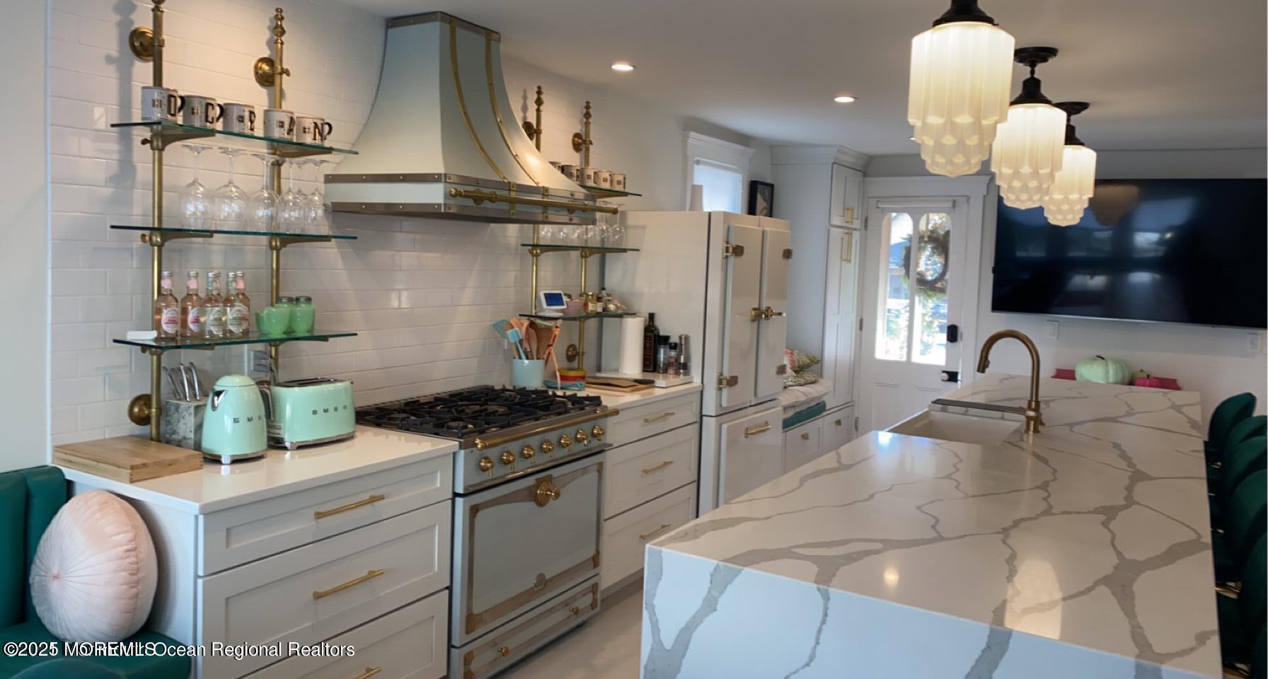 69 Webb Avenue Ocean Grove, NJ 07756 - Photo 27 of 70 a kitchen with stainless steel appliances granite countertop a sink and cabinets