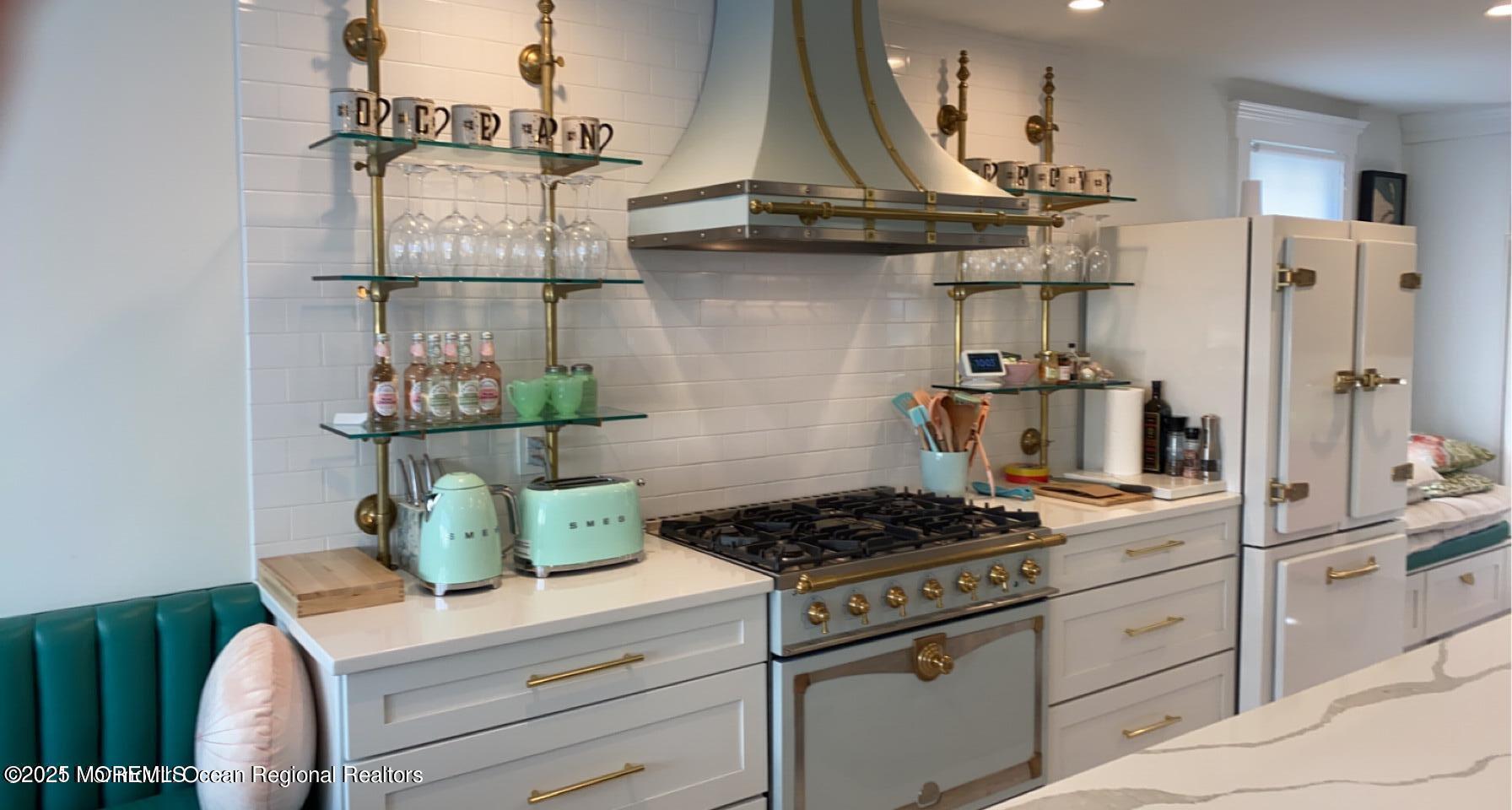 69 Webb Avenue Ocean Grove, NJ 07756 - Photo 28 of 70 a kitchen with a stove and cabinets