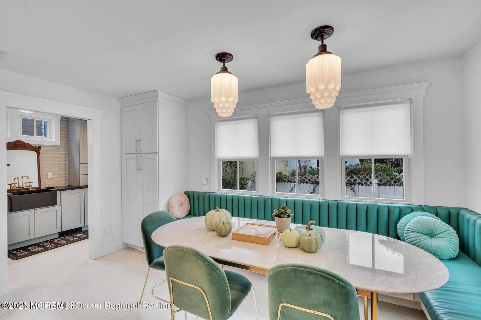 69 Webb Avenue Ocean Grove, NJ 07756 - Photo 35 of 70 a view of a dining room with furniture a kitchen and wooden floor