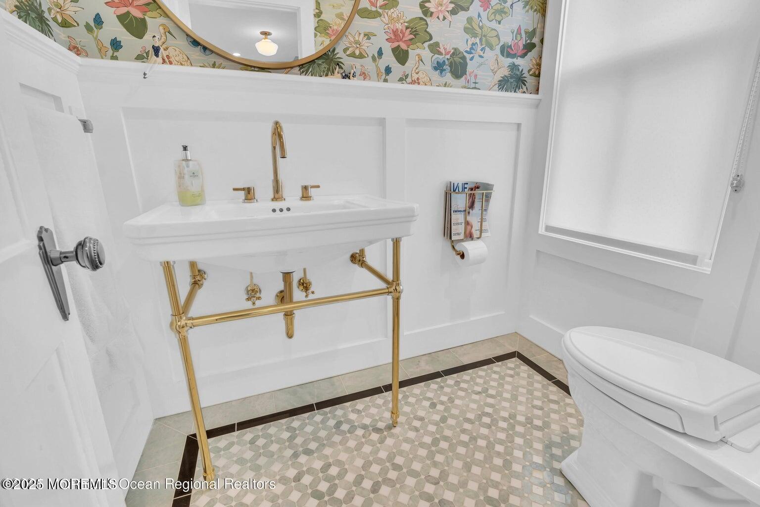 69 Webb Avenue Ocean Grove, NJ 07756 - Photo 39 of 70 a bathroom with a sink a toilet and mirror