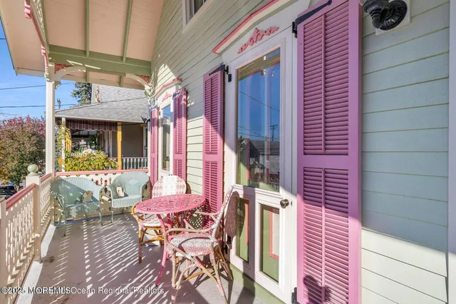 a view of a house with a wooden deck