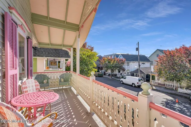 a view of a house with a wooden deck