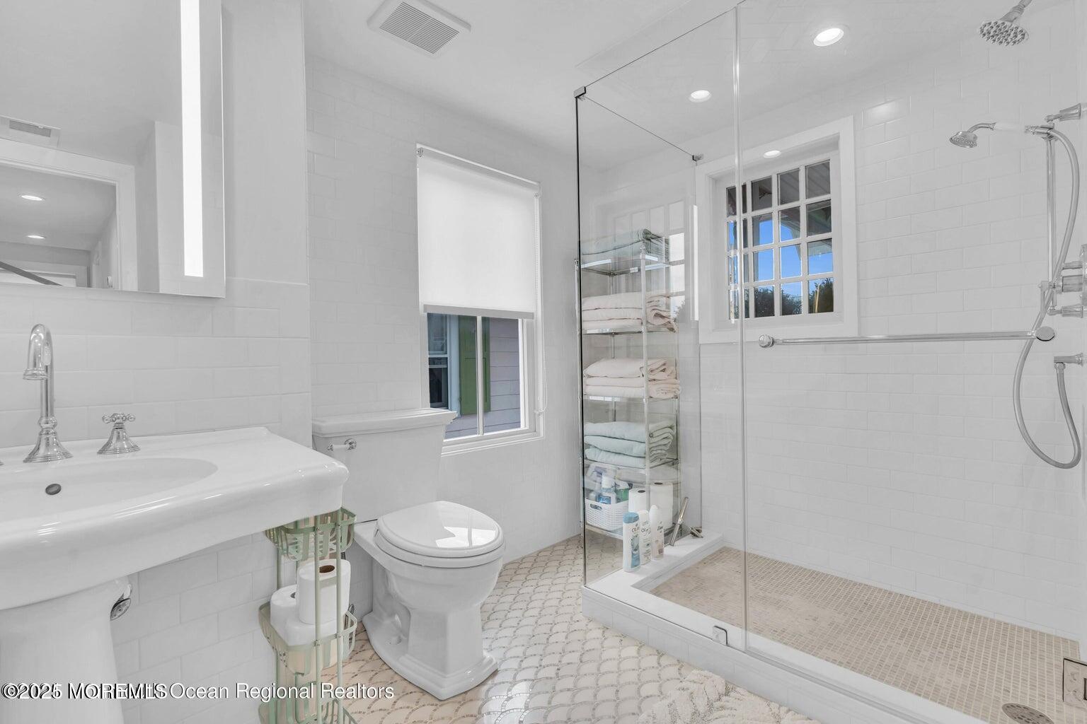 69 Webb Avenue Ocean Grove, NJ 07756 - Photo 56 of 70 a bathroom with a sink toilet and shower