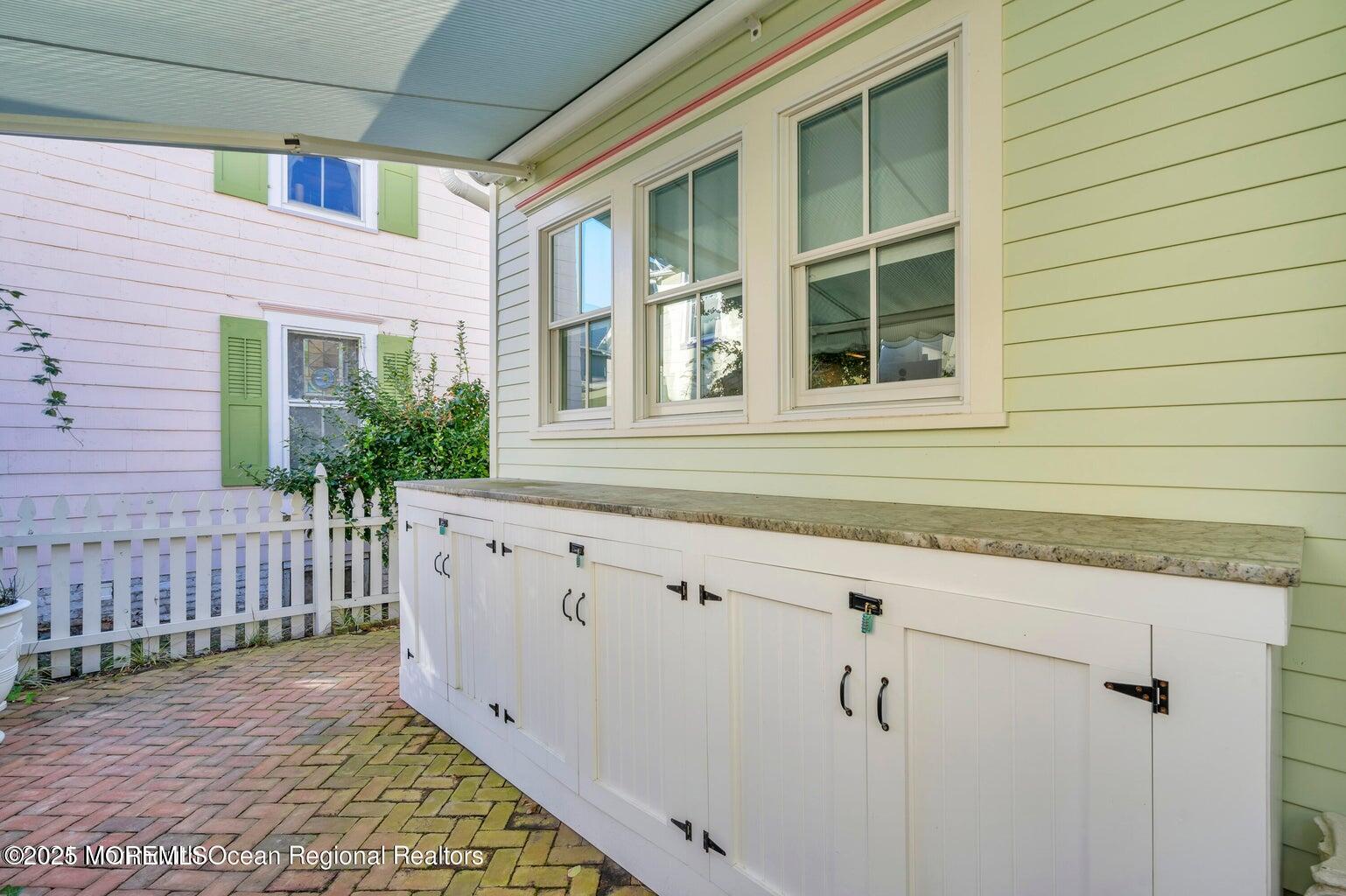 69 Webb Avenue Ocean Grove, NJ 07756 - Photo 61 of 70 a view of a house with a wooden deck