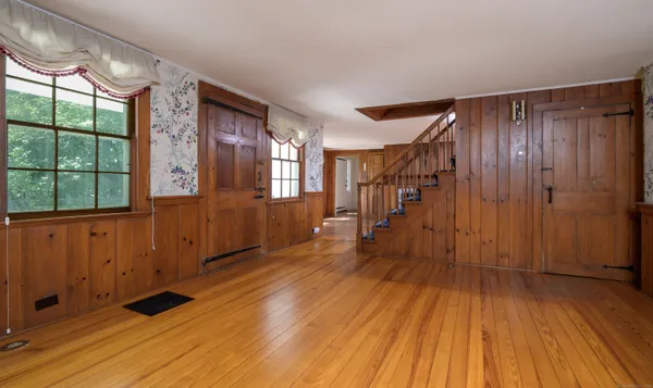a view of entryway with wooden floor