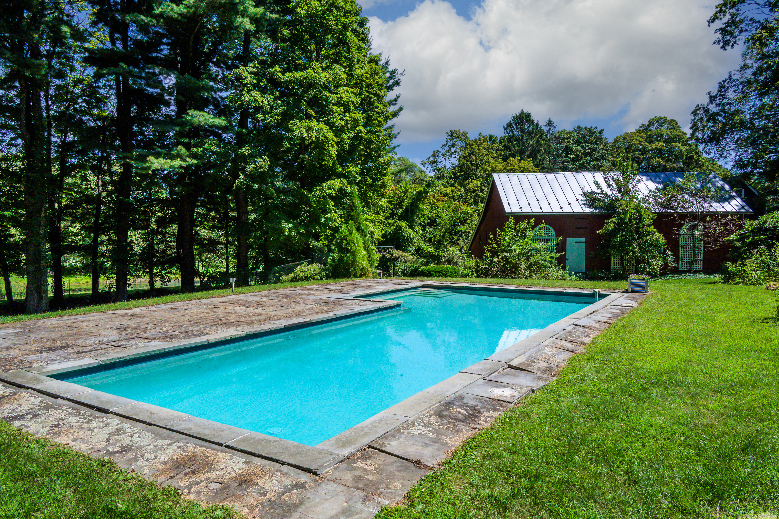 130 Sharon Mountain Road Sharon, CT 06069 - Photo 27 of 38 a view of a swimming pool with a yard and plants