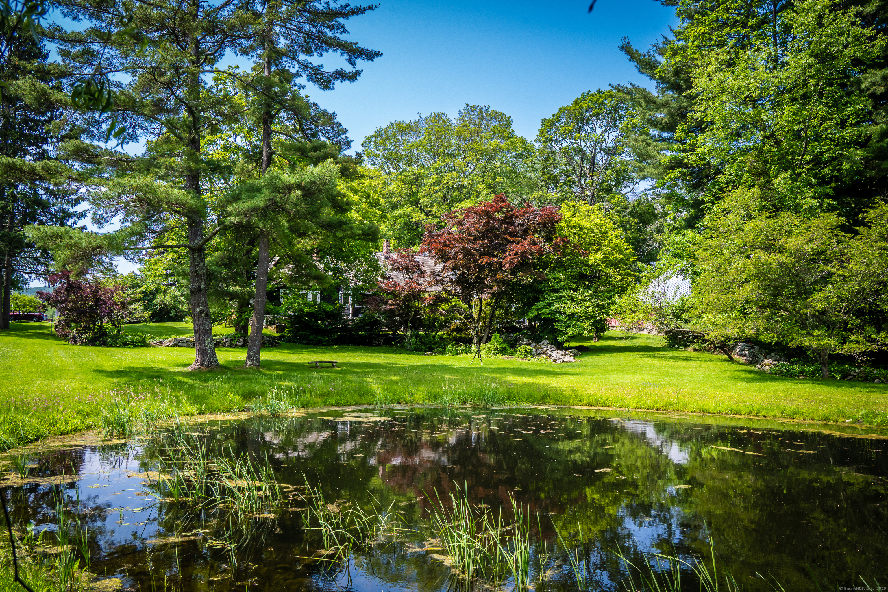 130 Sharon Mountain Road Sharon, CT 06069 - Photo 33 of 38 a view of a grassy field with trees