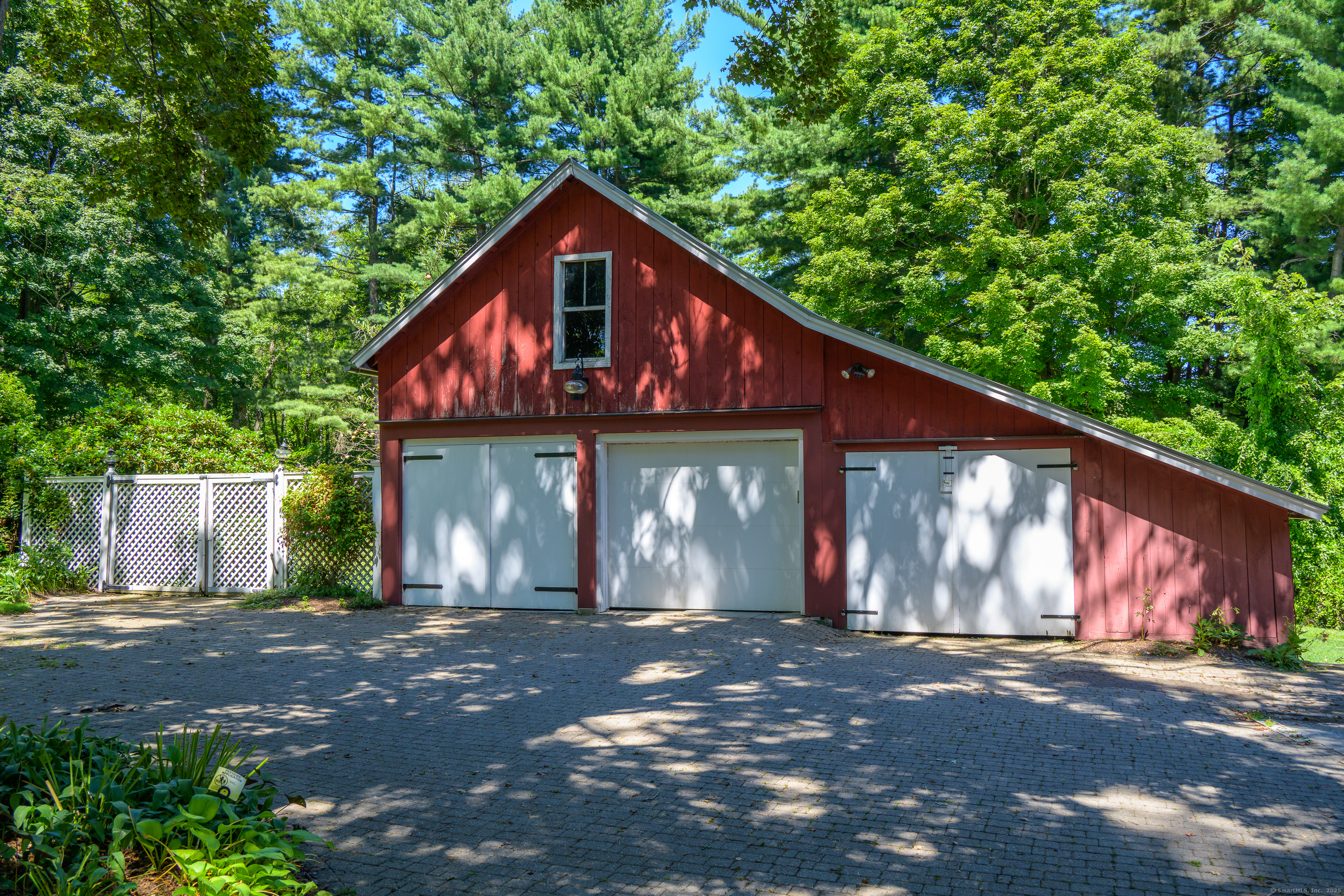 130 Sharon Mountain Road Sharon, CT 06069 - Photo 4 of 38 a view of a barn house with large windows and a small yard