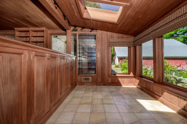 a view of a porch with wooden floor and stairs