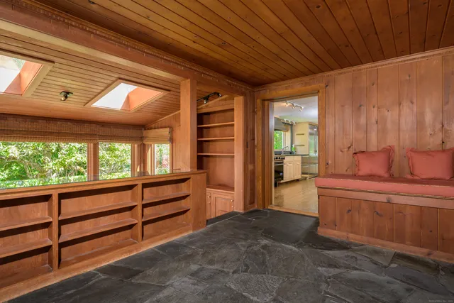 a room with window and cabinet