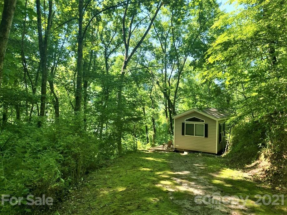 83 Choke Berry Ridge, Unit 1 Sylva, NC 28779 - Photo 2 of 13 a view of a house with a yard