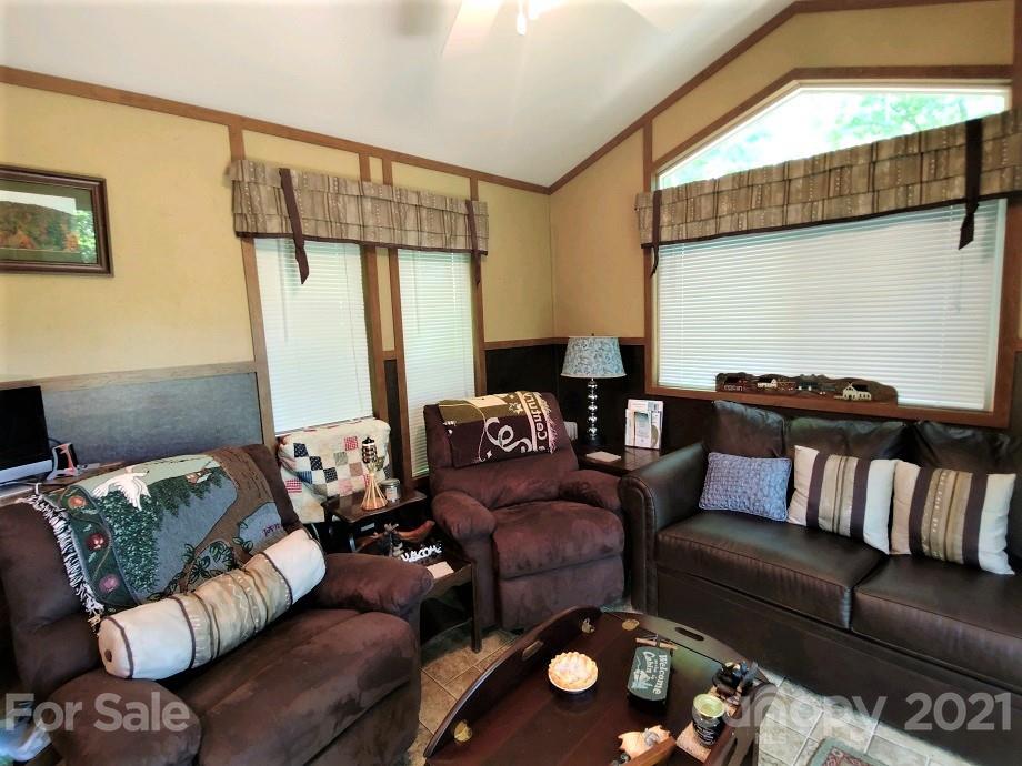 83 Choke Berry Ridge, Unit 1 Sylva, NC 28779 - Photo 5 of 13 a living room with furniture and a window