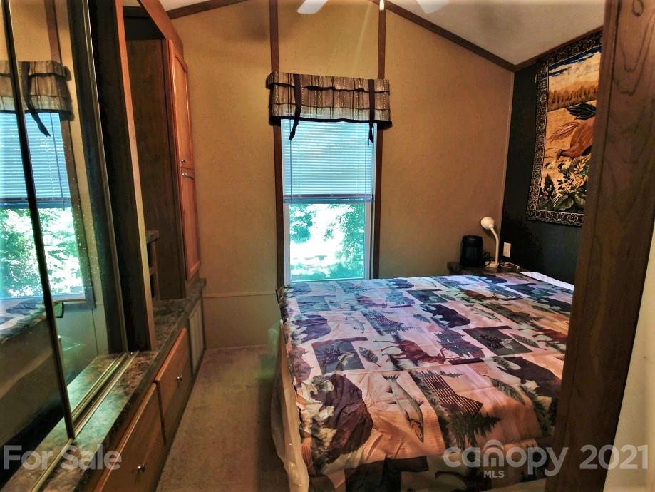 83 Choke Berry Ridge, Unit 1 Sylva, NC 28779 - Photo 6 of 13 a bedroom with a bed and a window