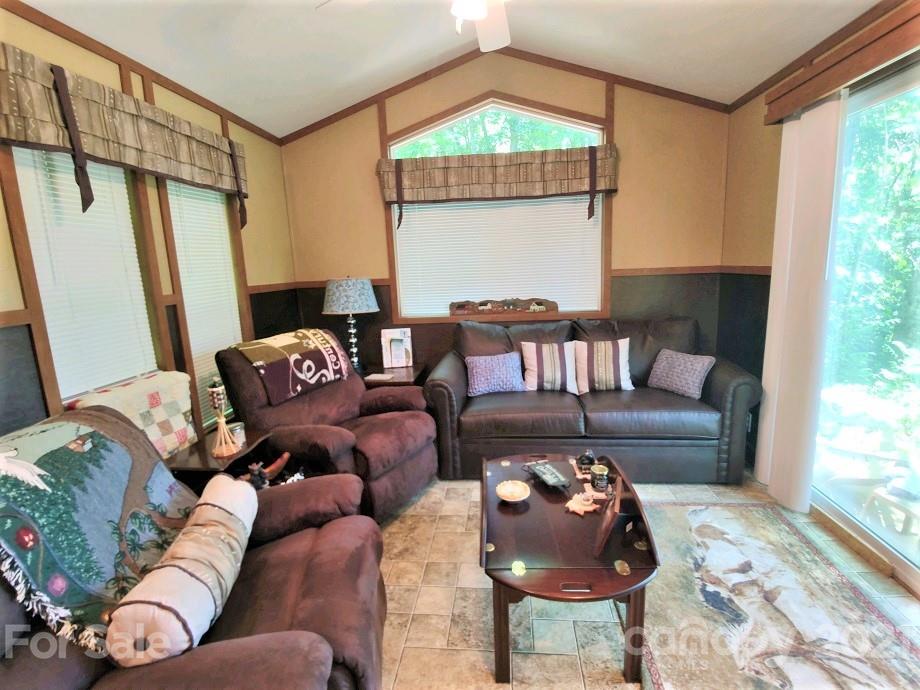 83 Choke Berry Ridge, Unit 1 Sylva, NC 28779 - Photo 7 of 13 a living room with furniture and a large window