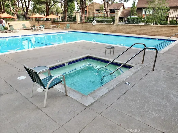 a view of a swimming pool with a lounge chairs