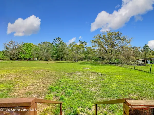 a view of an ocean and a yard