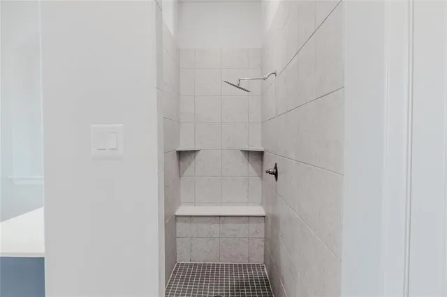 a bathroom with a sink and shower