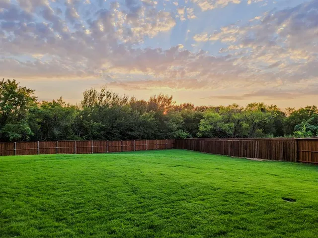 a view of swimming pool with a yard