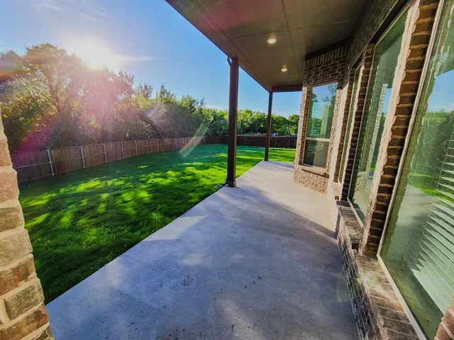 a view of a backyard with garden