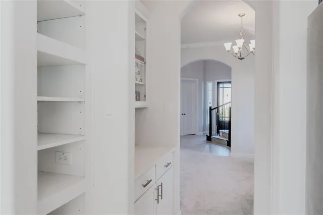 a view of an empty room with a mirror