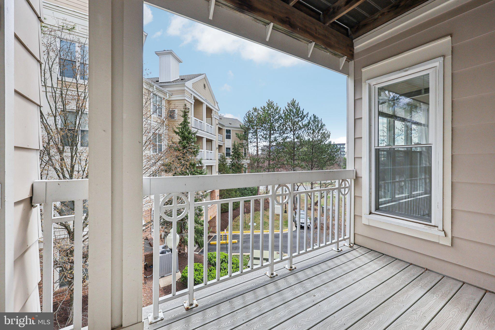 12919 Alton Square, Unit 302 Herndon, VA 20170 - Photo 15 of 21 a view of a balcony with wooden floor