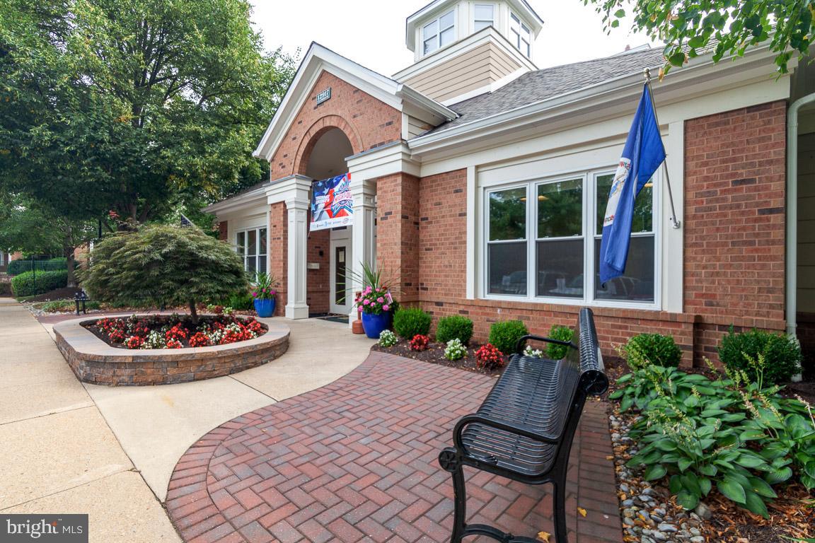 12919 Alton Square, Unit 302 Herndon, VA 20170 - Photo 16 of 21 a front view of house and yard with seating space
