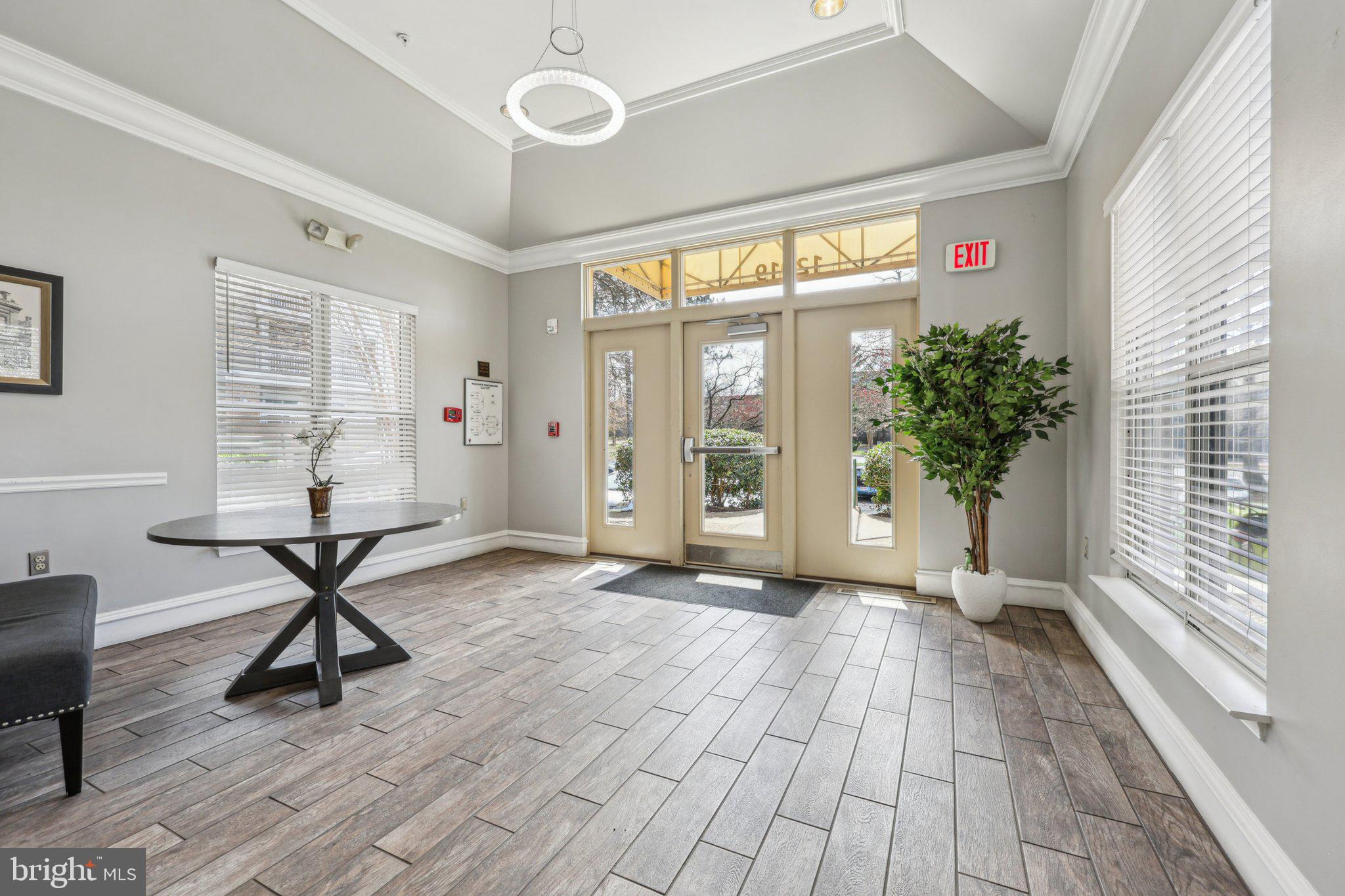 12919 Alton Square, Unit 302 Herndon, VA 20170 - Photo 2 of 21 a view of an empty room with a window and wooden floor