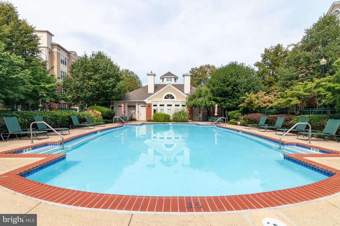 12919 Alton Square, Unit 302 Herndon, VA 20170 - Photo 21 of 21 a view of a swimming pool with an outdoor seating