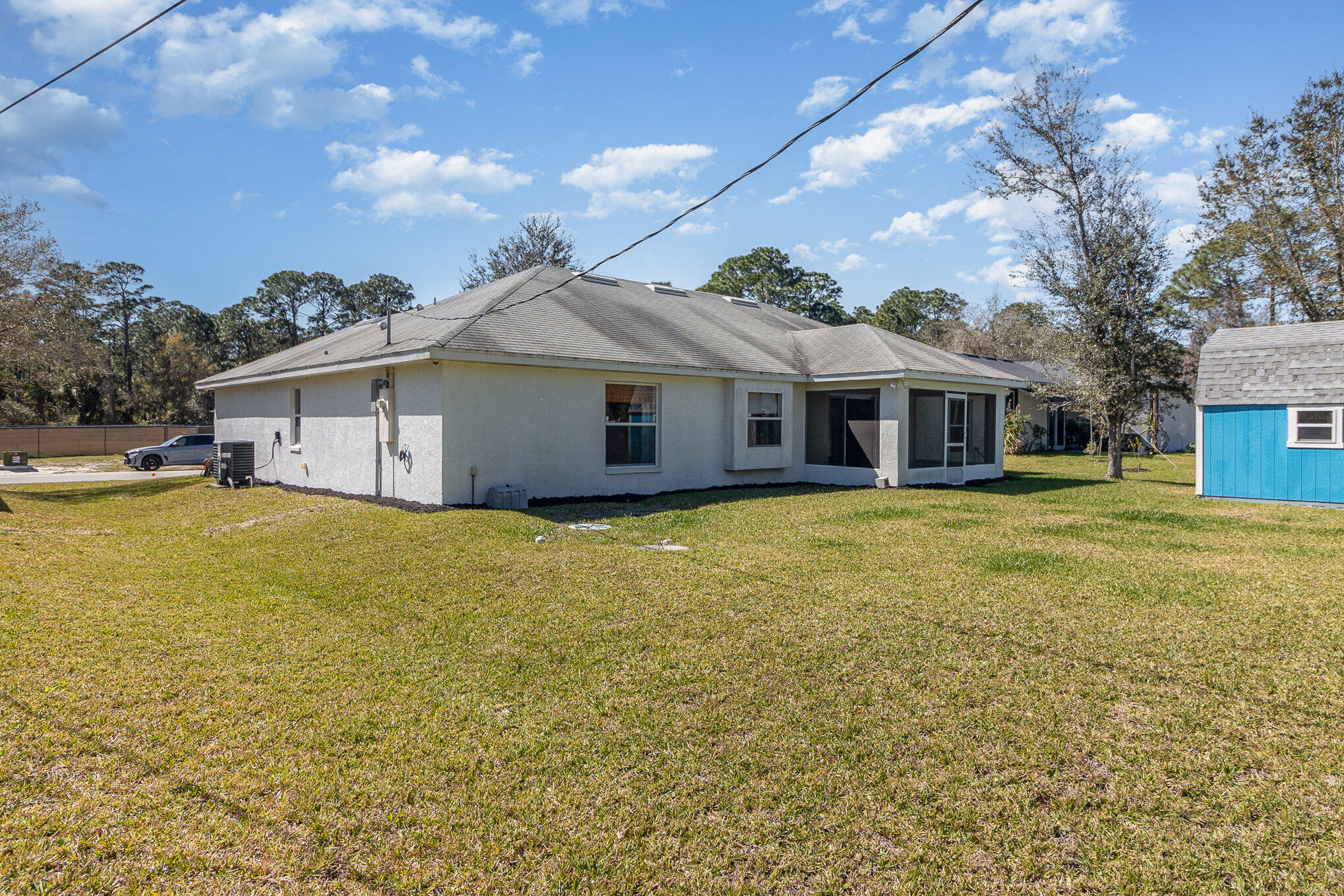 1391 Saxony Road Southwest Palm Bay, FL 32908 - Photo 25 of 28 a view of a house with a backyard