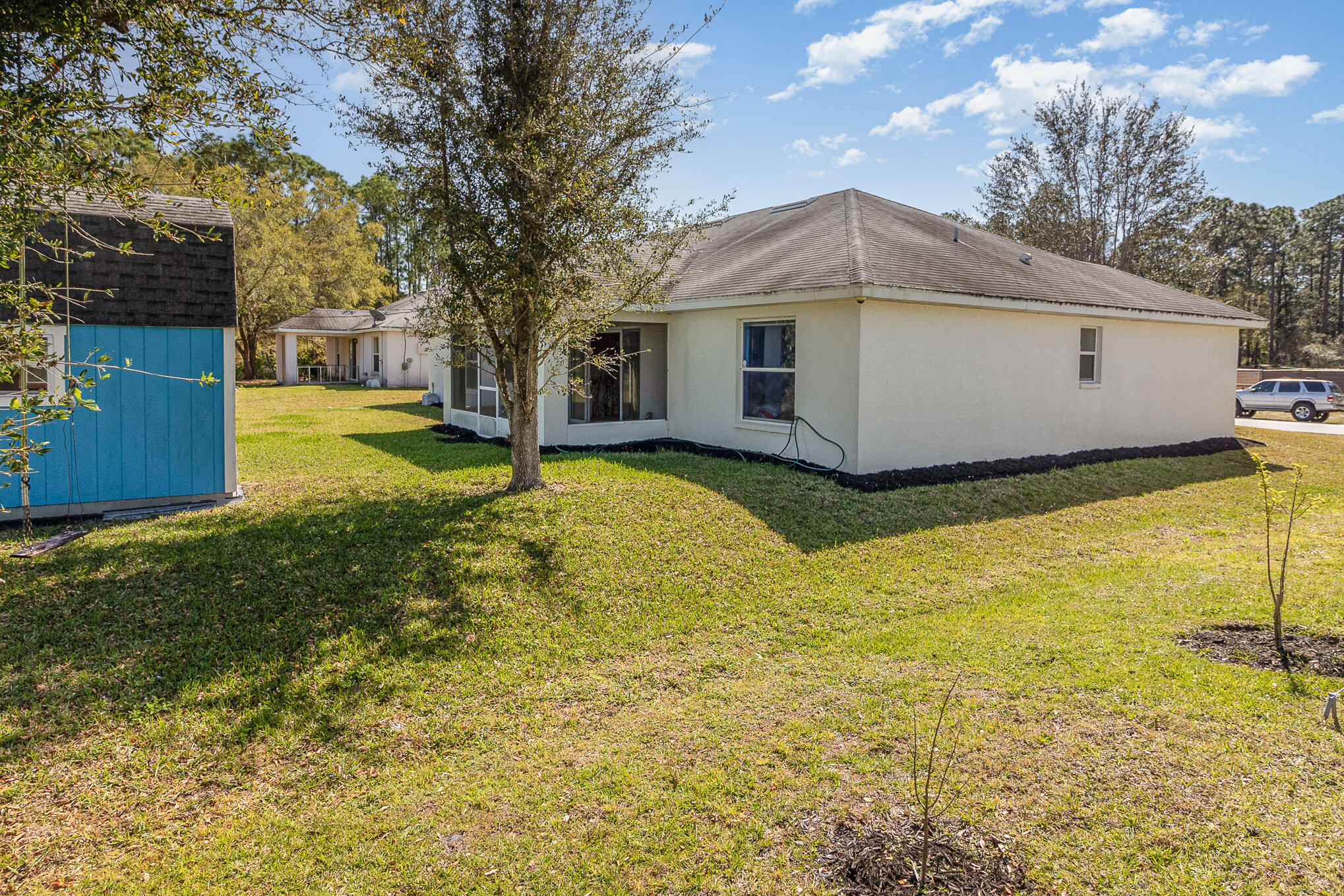 1391 Saxony Road Southwest Palm Bay, FL 32908 - Photo 26 of 28 a view of a house with pool and yard