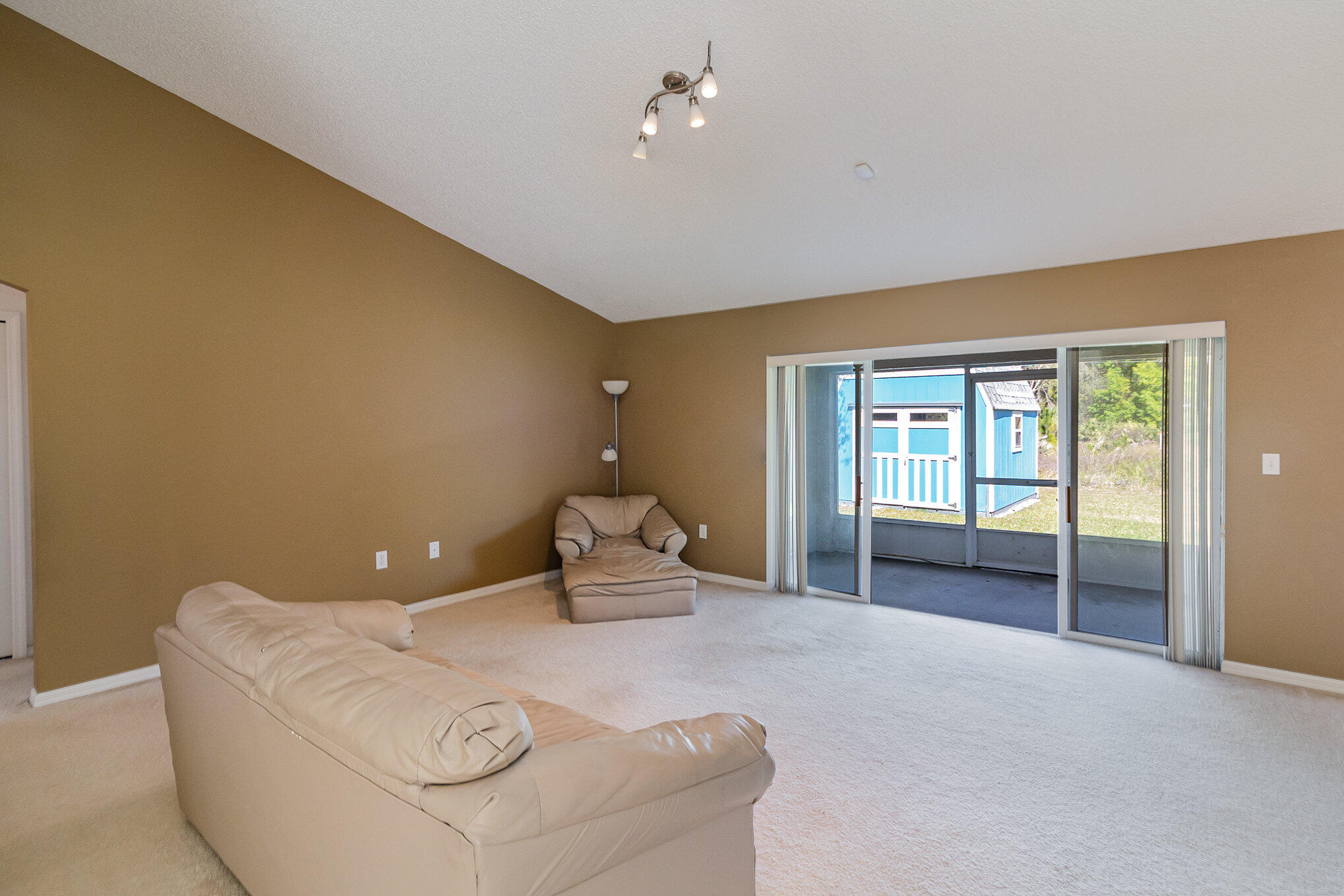 1391 Saxony Road Southwest Palm Bay, FL 32908 - Photo 6 of 28 a living room with furniture