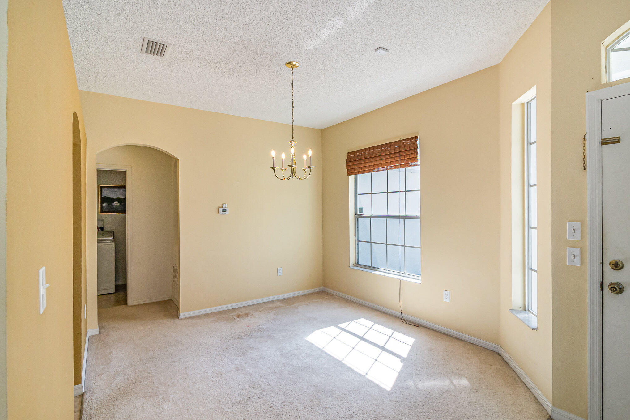 1391 Saxony Road Southwest Palm Bay, FL 32908 - Photo 10 of 28 a view of an empty room with a window