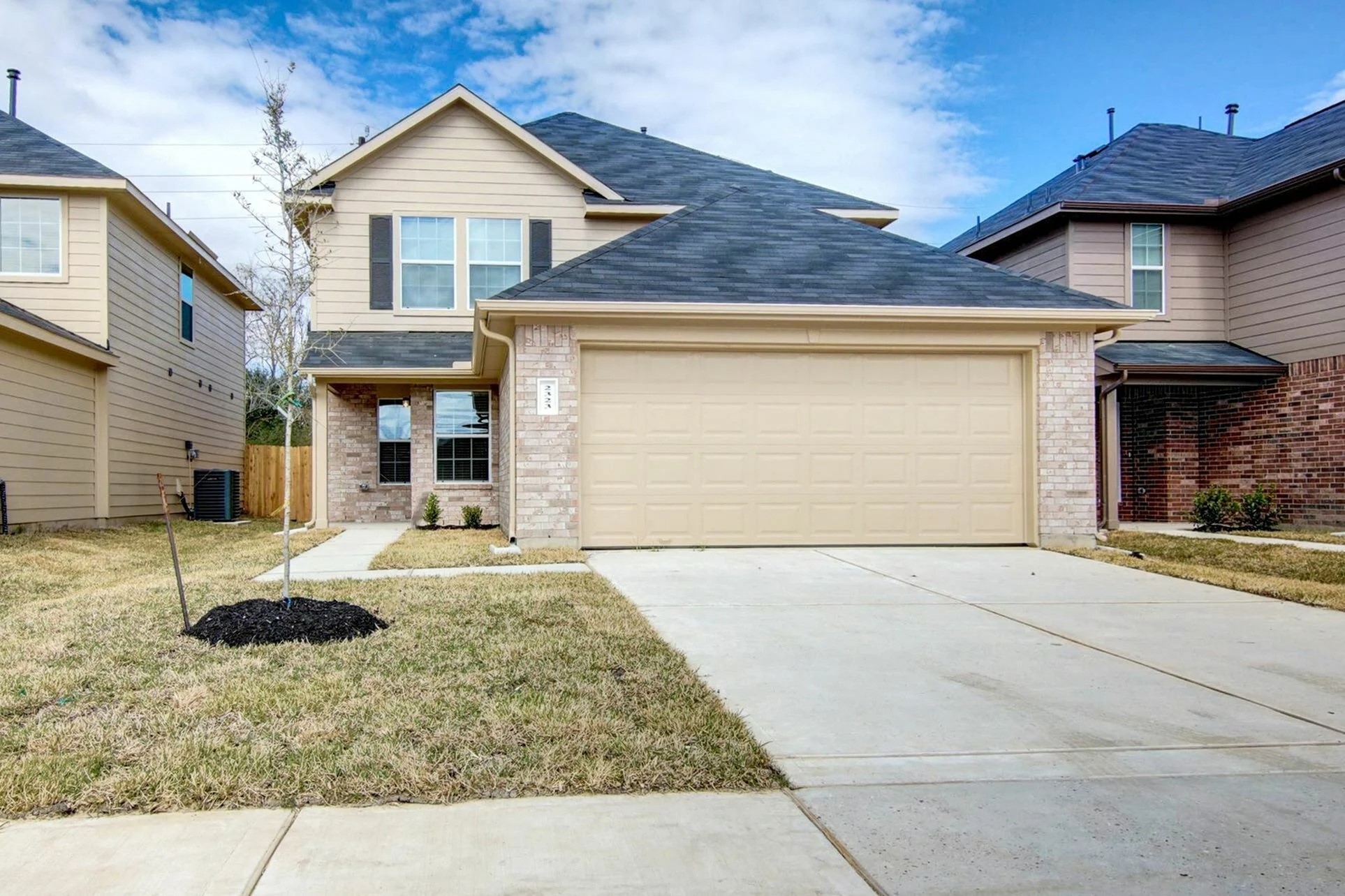 a front view of a house with yard