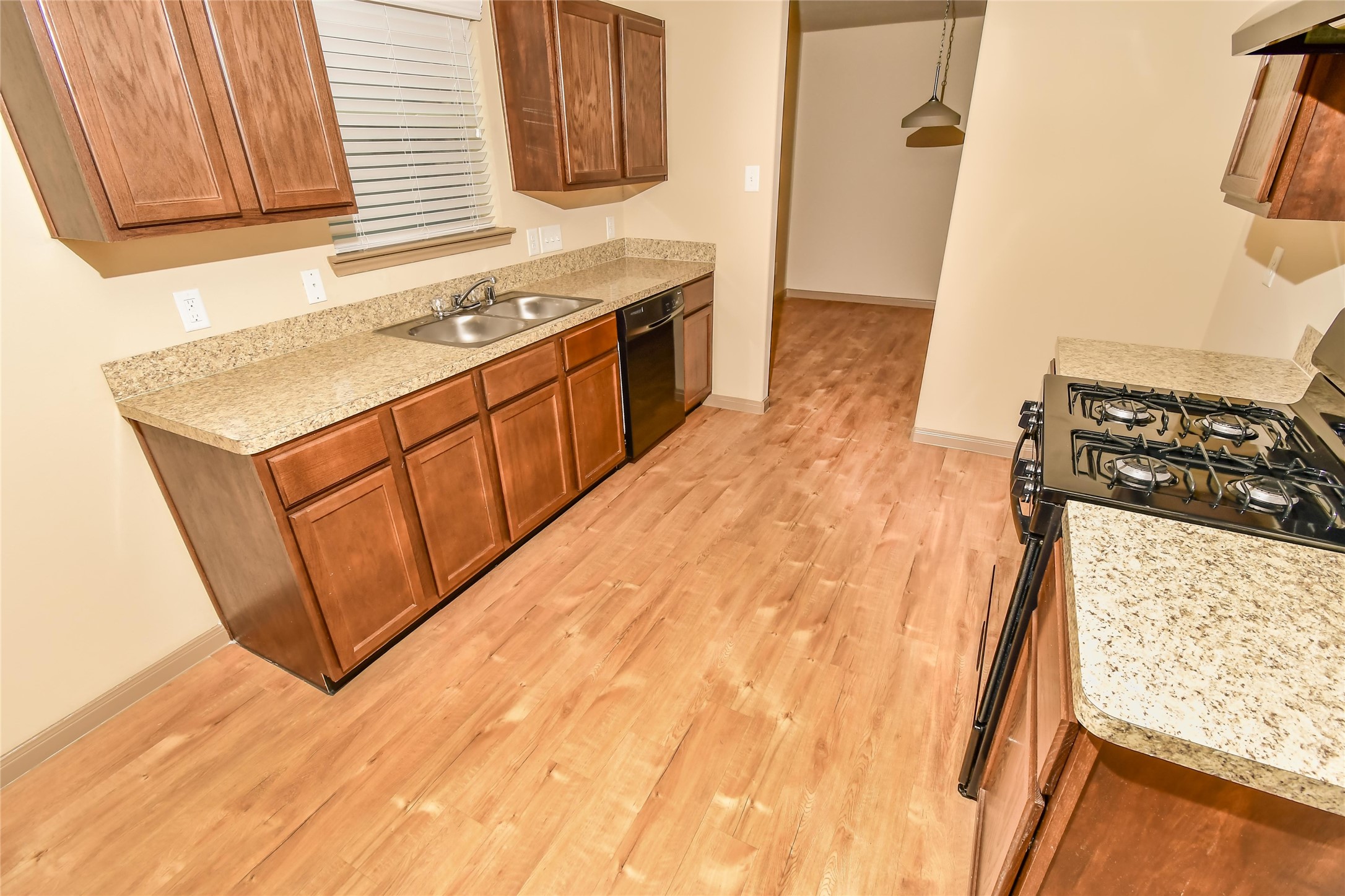 2323 Kolby Way Houston, TX 77073 - Photo 7 of 13 a kitchen with a sink stove and cabinets