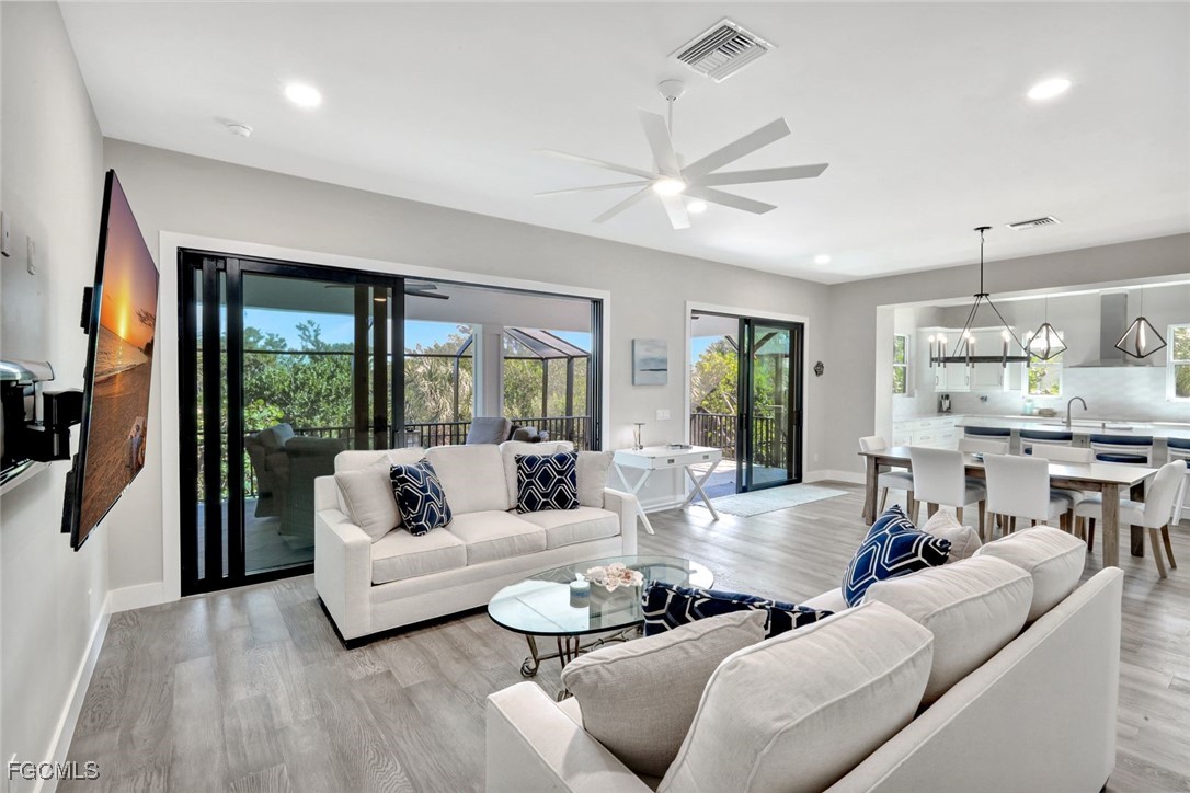 1044 Fish Crow Road Sanibel, FL 33957 - Photo 11 of 36 a living room with furniture and a large window