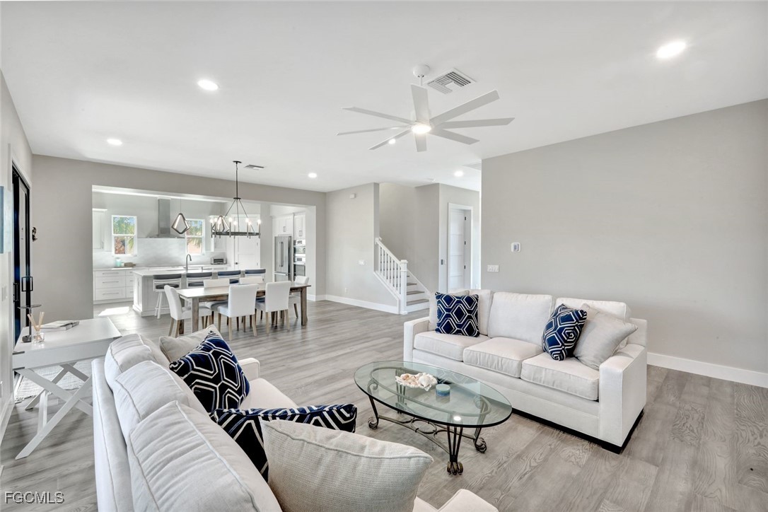 1044 Fish Crow Road Sanibel, FL 33957 - Photo 13 of 36 a living room with furniture and a view of kitchen