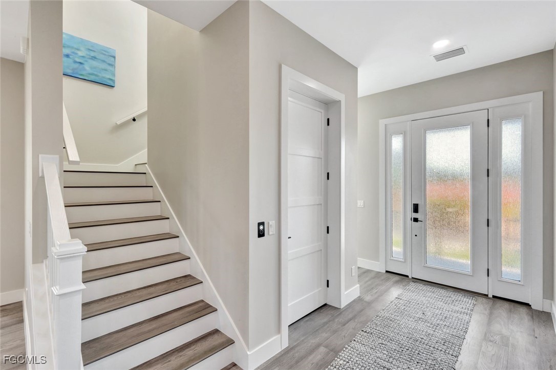 1044 Fish Crow Road Sanibel, FL 33957 - Photo 15 of 36 a view of a hallway with wooden floor and entryway